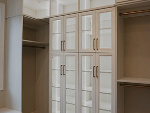 walk in closet with cabinets